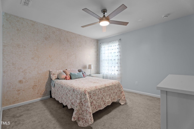 carpeted bedroom featuring baseboards, a ceiling fan, and wallpapered walls
