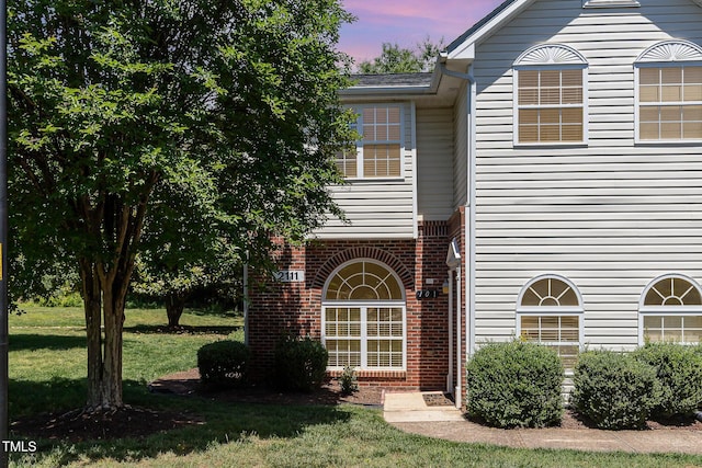 2111 Piney Brook Rd Unit 101, Raleigh, NC 27614 - view of front facade with brick siding and a front yard