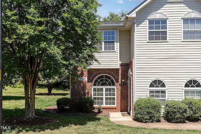 2111 Piney Brook Rd Unit 101, Raleigh, NC 27614 - townhome / multi-family property with a front lawn and brick siding