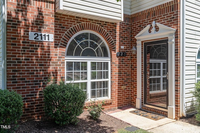 2111 Piney Brook Rd Unit 101, Raleigh, NC 27614 - doorway to property with brick siding