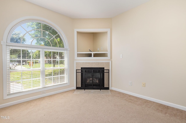 2111 Piney Brook Rd Unit 101, Raleigh, NC 27614 - unfurnished living room featuring carpet and a tiled fireplace