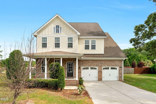 2808 Sand Trap Ln, Hope Mills, NC 28348 - view of front of property featuring brick siding, driveway, board and batten siding, roof with shingles, and a porch