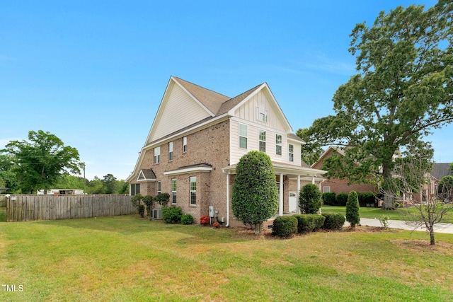 2808 Sand Trap Ln, Hope Mills, NC 28348 - view of property exterior with board and batten siding, brick siding, and central air condition unit