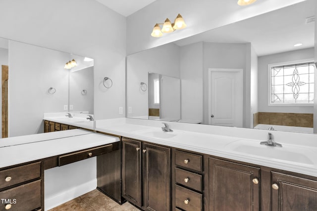 2808 Sand Trap Ln, Hope Mills, NC 28348 - bathroom with double vanity, a tub, and tile patterned flooring