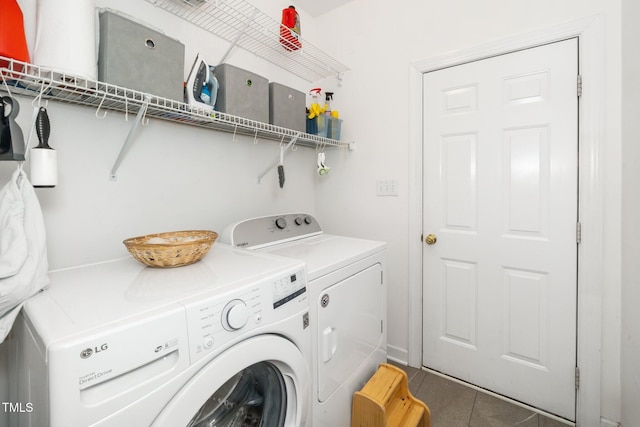 washroom featuring washer and dryer and tile patterned floors