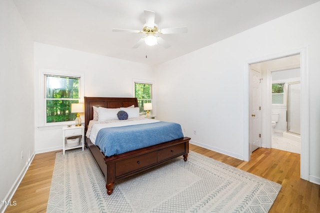 bedroom featuring light wood-style flooring, baseboards, and a ceiling fan