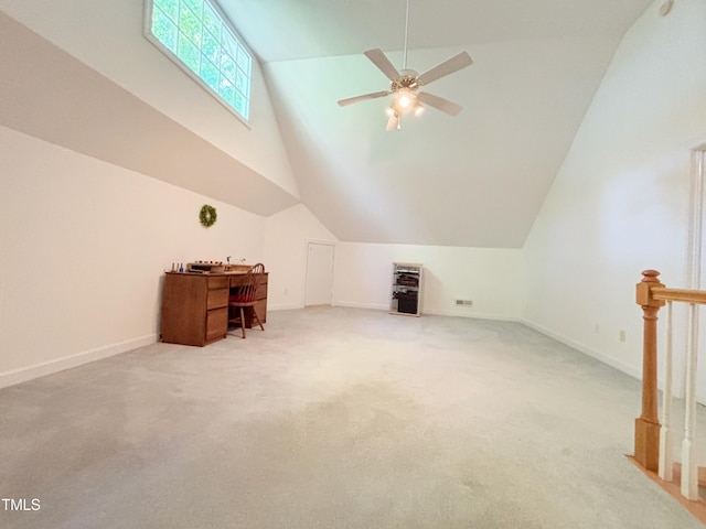 bonus room with lofted ceiling, light carpet, baseboards, and a ceiling fan