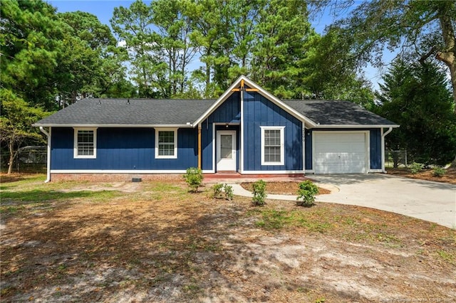 single story home with driveway, an attached garage, and crawl space