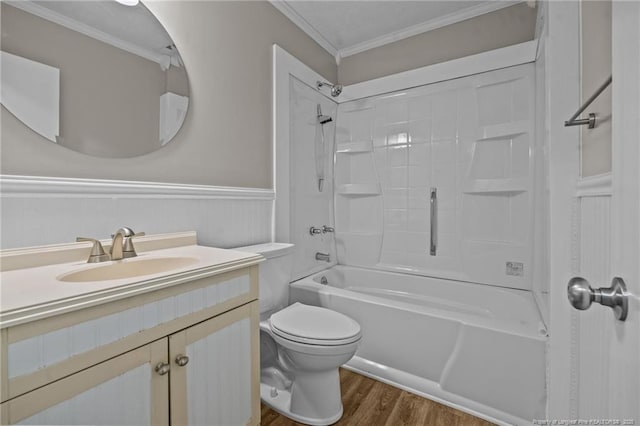 bathroom featuring wood finished floors, ornamental molding, toilet, vanity, and wainscoting