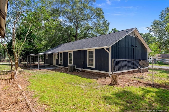 view of front of home with cooling unit and a shingled roof