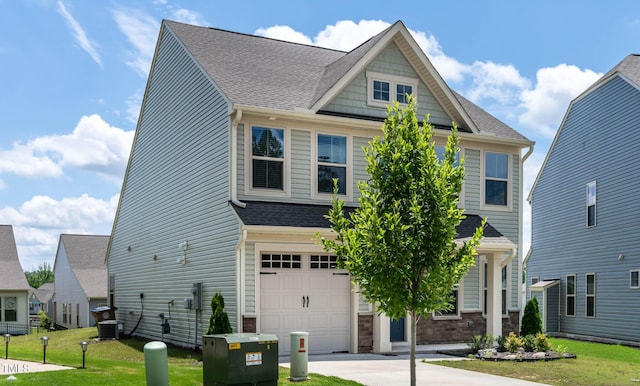 1745 Ripley Woods St, Wake Forest, NC 27587 - craftsman inspired home featuring a garage, a front lawn, roof with shingles, concrete driveway, and stone siding