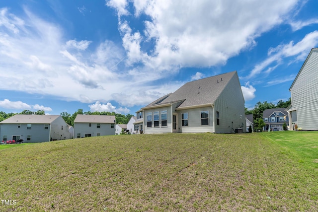 1745 Ripley Woods St, Wake Forest, NC 27587 - rear view of house with a lawn and a residential view