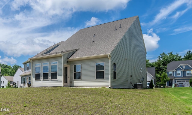 1745 Ripley Woods St, Wake Forest, NC 27587 - back of property with a lawn and a shingled roof
