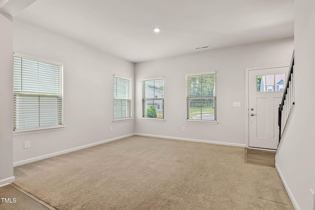 1745 Ripley Woods St, Wake Forest, NC 27587 - entryway featuring light carpet, stairway, and recessed lighting