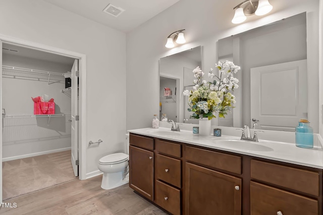 1745 Ripley Woods St, Wake Forest, NC 27587 - full bath featuring double vanity, wood finished floors, and a walk in closet