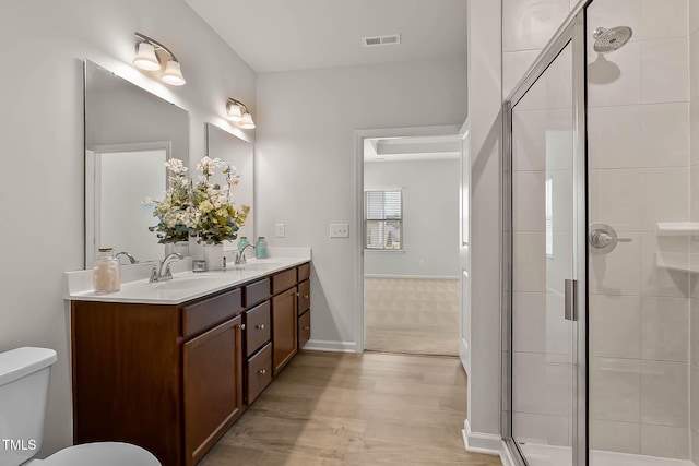 1745 Ripley Woods St, Wake Forest, NC 27587 - full bath featuring double vanity, a stall shower, and wood finished floors