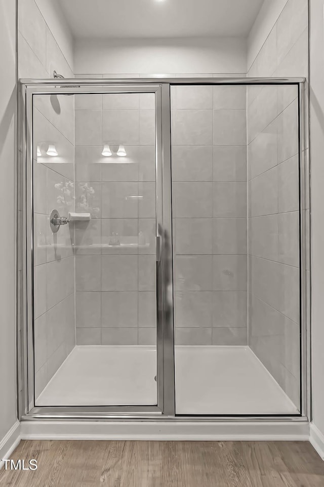 1745 Ripley Woods St, Wake Forest, NC 27587 - bathroom featuring a shower stall and wood finished floors