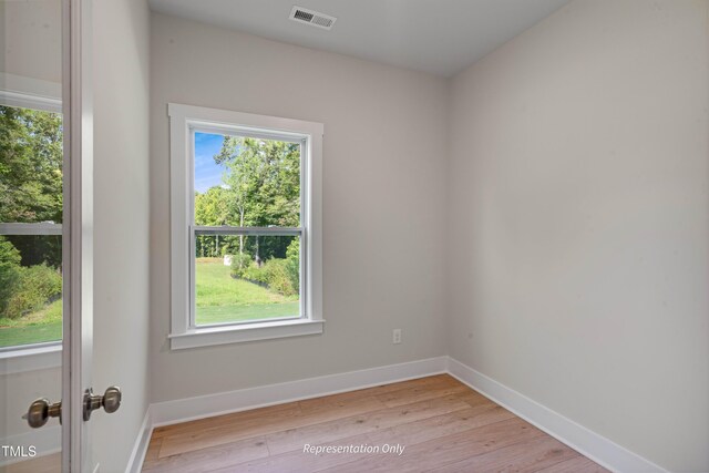 1913 Ballard Rd Unit 193, Fuquay Varina, NC 27526 - empty room with healthy amount of natural light, light wood-style flooring, and baseboards