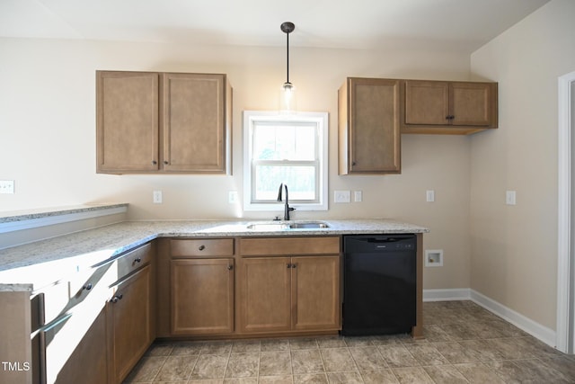 kitchen featuring a sink, dishwasher, brown cabinetry, pendant lighting, and baseboards