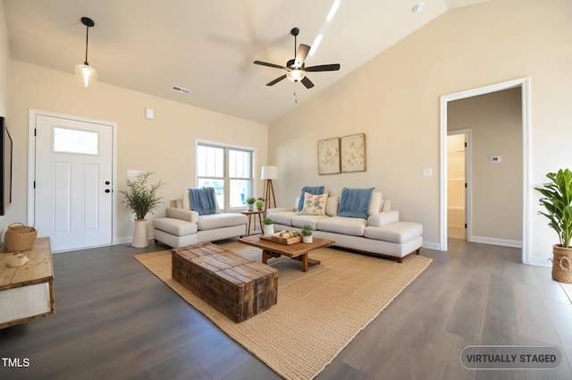 404 S Eastwood Dr, Benson, NC 27504 - living area with a ceiling fan, high vaulted ceiling, dark wood-style floors, and baseboards