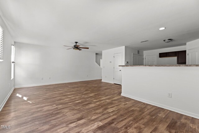 unfurnished living room featuring ceiling fan, wood finished floors, baseboards, and recessed lighting