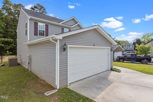 view of property exterior featuring a yard, concrete driveway, and central AC