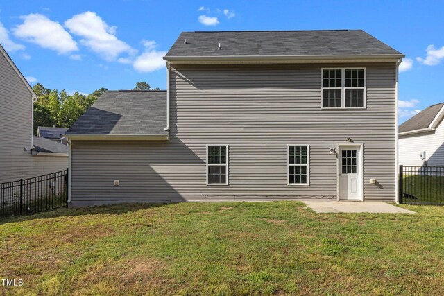 back of house with a patio