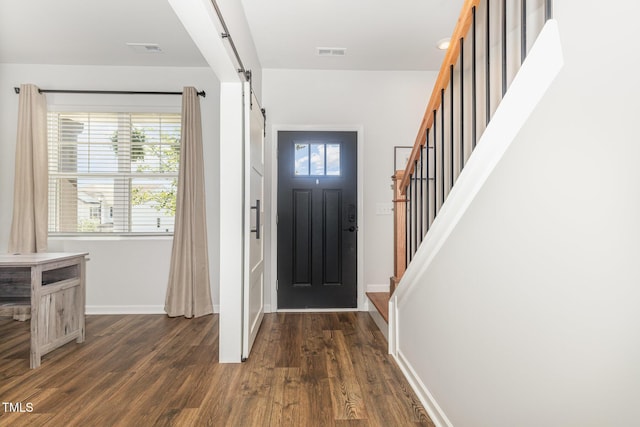 19 Cecina Ct, Clayton, NC 27527 - foyer featuring stairway, dark wood finished floors, baseboards, and a barn door