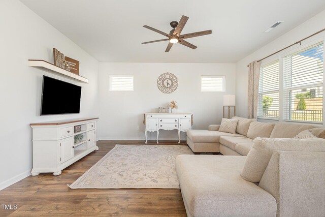 19 Cecina Ct, Clayton, NC 27527 - living area with ceiling fan, plenty of natural light, baseboards, and dark wood-type flooring