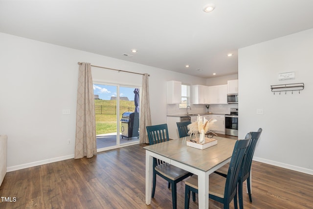 19 Cecina Ct, Clayton, NC 27527 - dining area featuring dark wood finished floors, baseboards, and recessed lighting