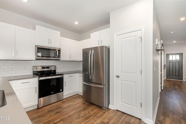 19 Cecina Ct, Clayton, NC 27527 - kitchen with stainless steel appliances, dark wood-type flooring, white cabinets, and recessed lighting