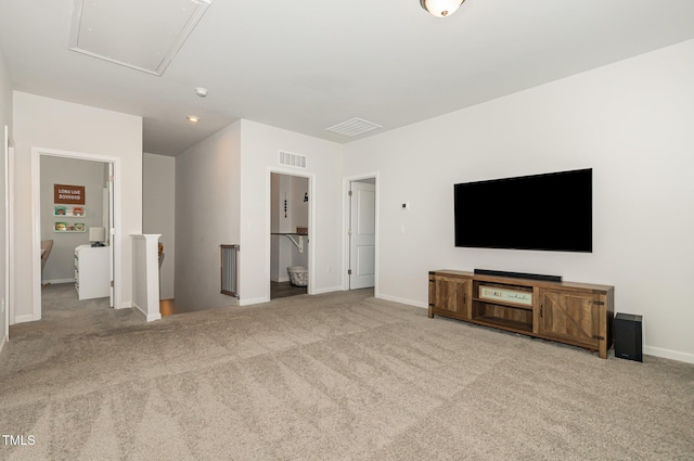 19 Cecina Ct, Clayton, NC 27527 - unfurnished living room with attic access, carpet, and baseboards