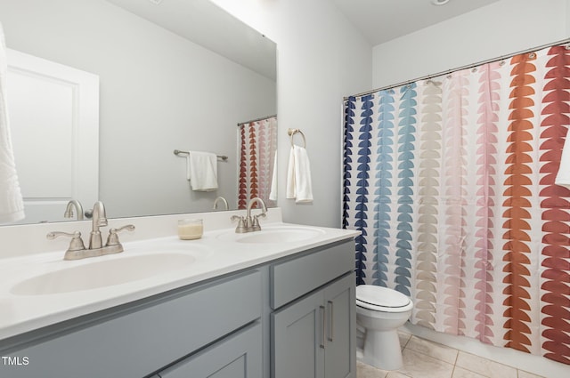 19 Cecina Ct, Clayton, NC 27527 - bathroom with tile patterned flooring, toilet, double vanity, and a shower with shower curtain