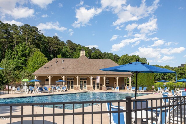 19 Cecina Ct, Clayton, NC 27527 - community pool with french doors, fence, and a patio
