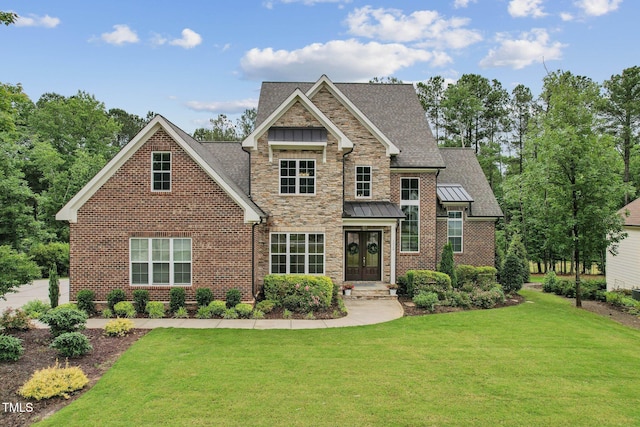 craftsman house featuring a front lawn, french doors, a standing seam roof, a shingled roof, and brick siding
