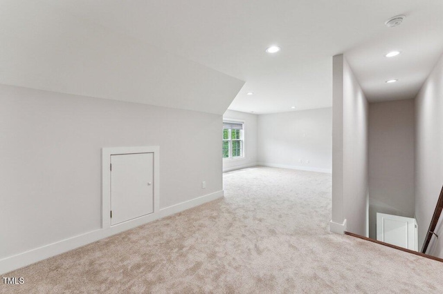 additional living space with carpet, baseboards, and recessed lighting