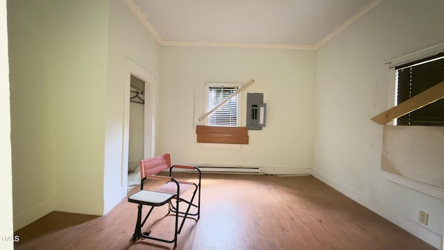 752 Nashville Rd, Rocky Mount, NC 27803 - spare room featuring ornamental molding, wood finished floors, baseboard heating, baseboards, and electric panel