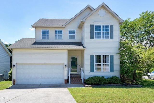 view of front of property with driveway, a front yard, central AC, and a shingled roof