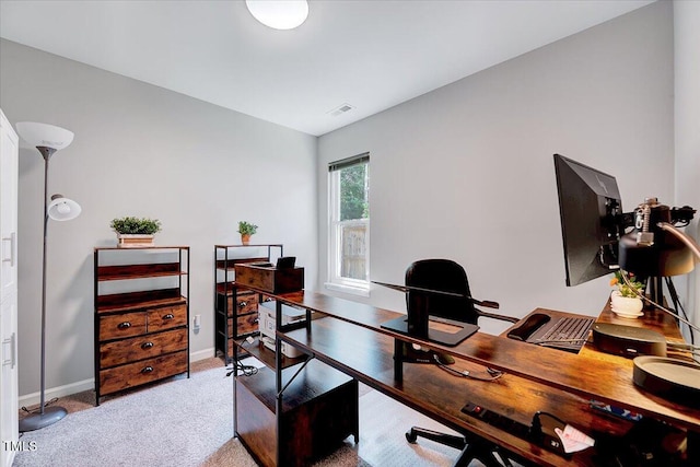 carpeted office featuring baseboards