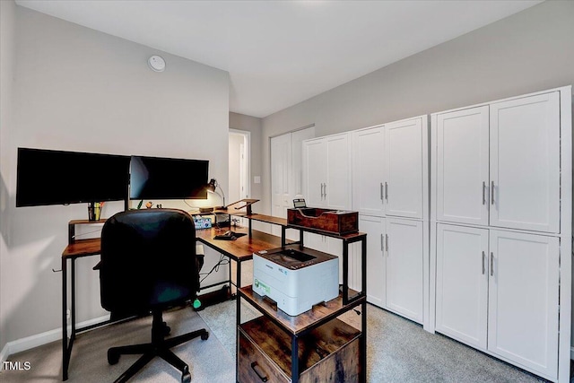 home office featuring baseboards and carpet