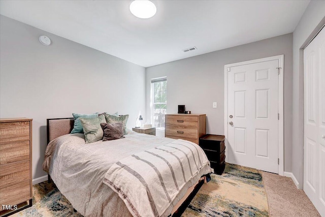 carpeted bedroom with baseboards