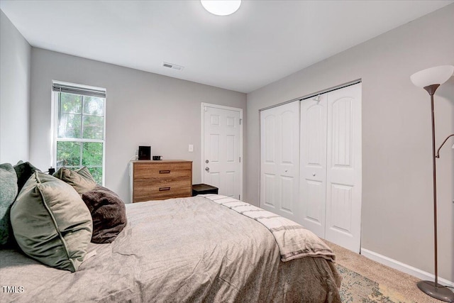 bedroom featuring carpet floors, a closet, and baseboards
