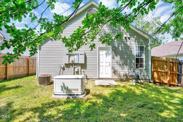 back of house with central AC