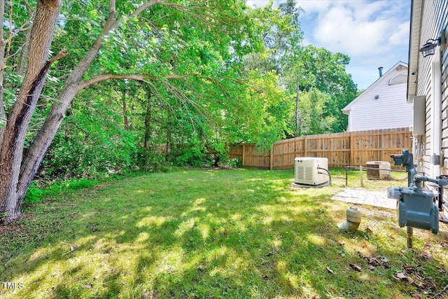 view of yard with central AC unit