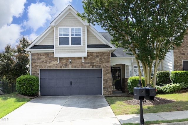 craftsman-style home featuring stone siding, driveway, an attached garage, and fence