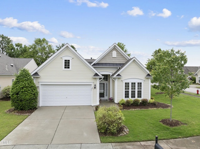 traditional-style home featuring driveway and a front lawn
