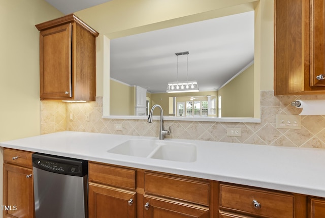 kitchen featuring stainless steel dishwasher, a sink, light countertops, brown cabinetry, and tasteful backsplash