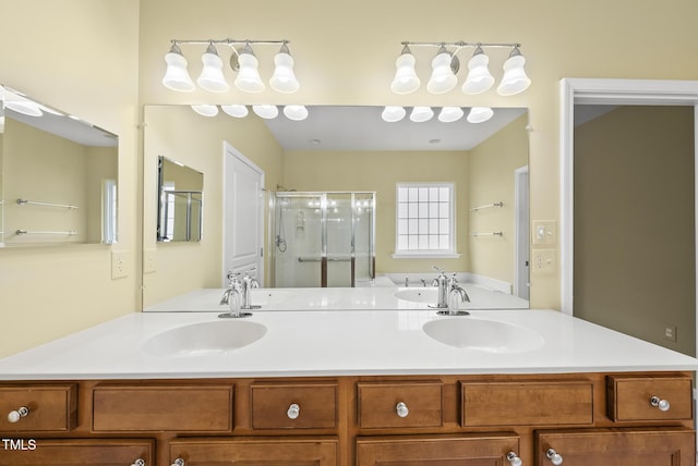full bath with a stall shower and double vanity