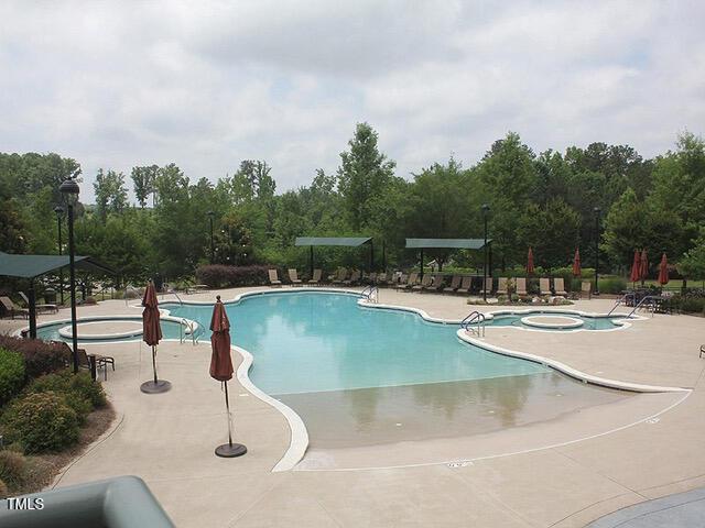 community pool with a patio