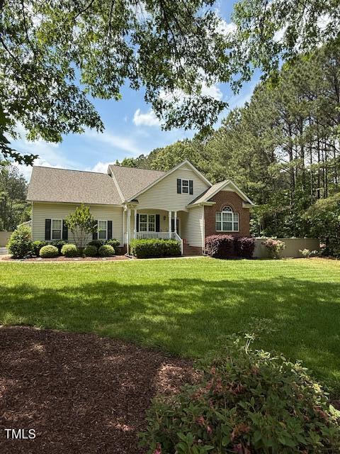 ranch-style home with a front lawn